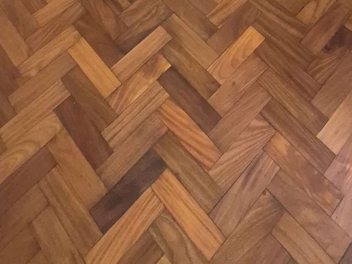 Close up of Iroko herringbone parquet after Arboritec Miracle Oil 2K in Neutral, showing open grain and tight joints