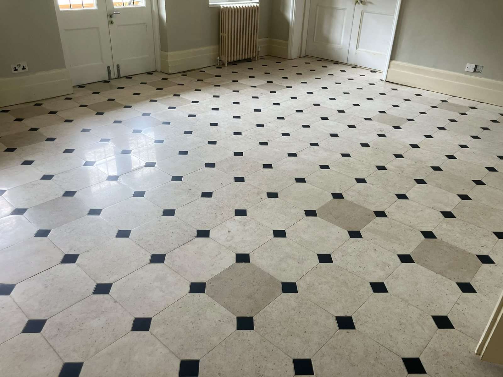 The same limestone room after grinding and sealing, flat and even with a soft sheen
